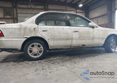 1997 Toyota Corolla Dx z USA, uszkodzony, nr VIN 2T1BB02E3VC181698